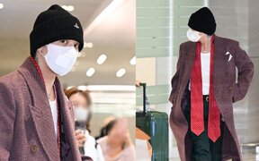 G-Dragon stuns at the airport in a burgundy long coat as he returns from overseas and prepares for his world tour encores