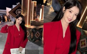 IU draws attention with bold red suit in behind the scenes photos as she teases her character’s “flashy entrance” in "Perfect Crown"